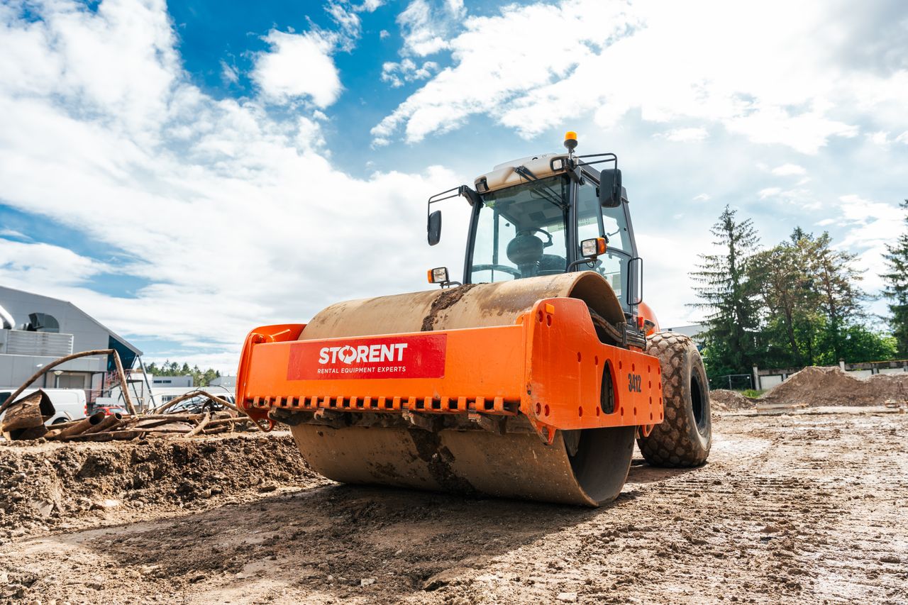 who-we-are Large vibratory roller compactor on a sunny construction site in Keila, Estonia.